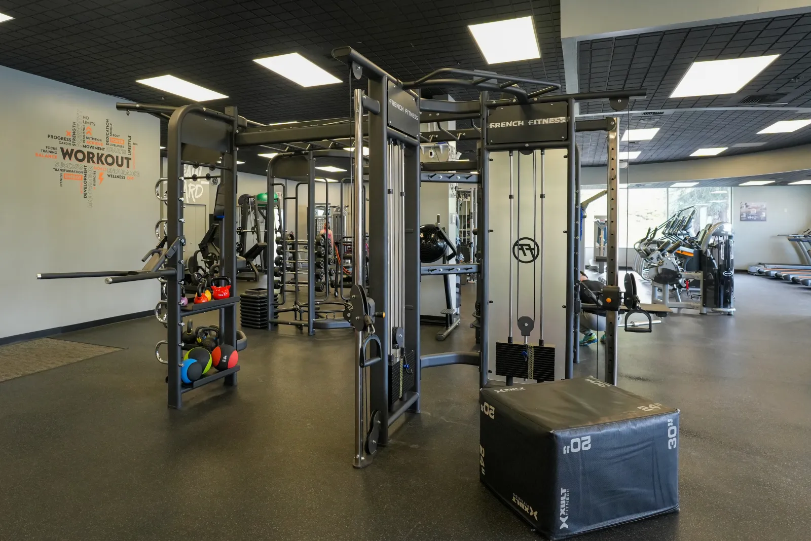 Functional training area with a cable machine, plyo boxes, and medicine balls at BR Fitness in East Anchorage