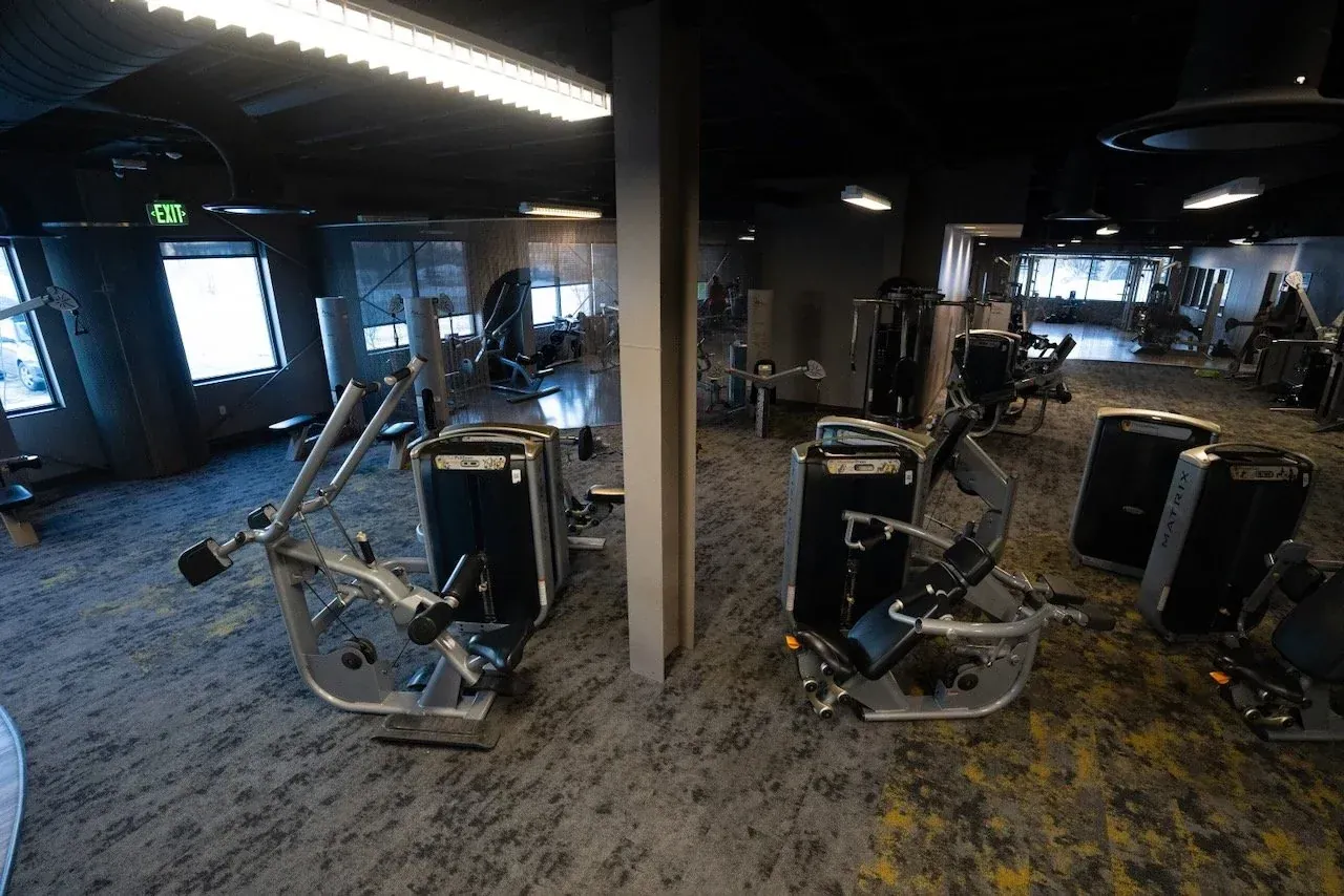 Free weight floor with dumbbells and benches at Body Renew Alaska