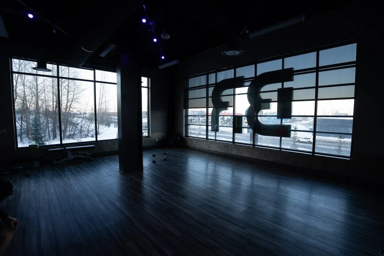 Open workout room with training equipment at Body Renew Alaska