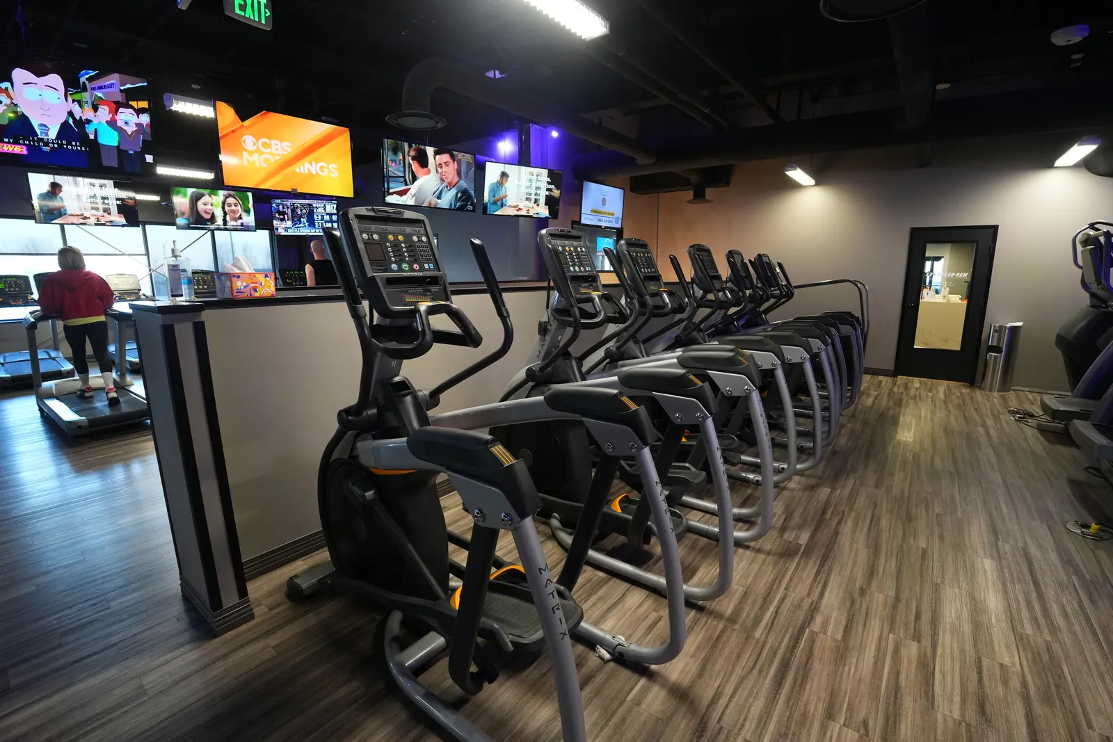 Row of cardio machines with personal viewing screens at Body Renew Alaska in South Anchorage